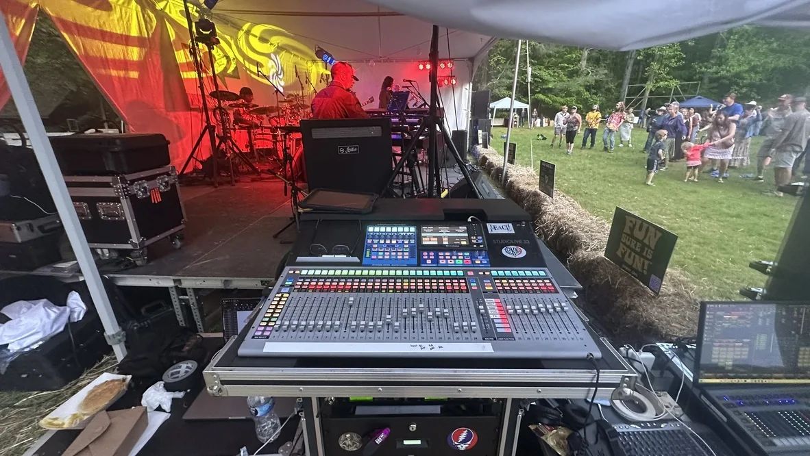 Digital mixing console at an outdoor festival